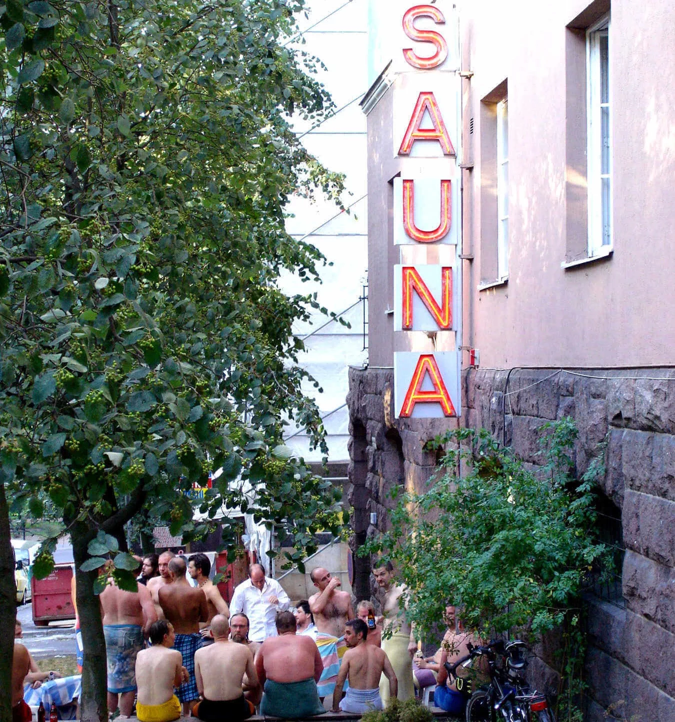 Men relax inside — and outside of — this sauna in Helsinki