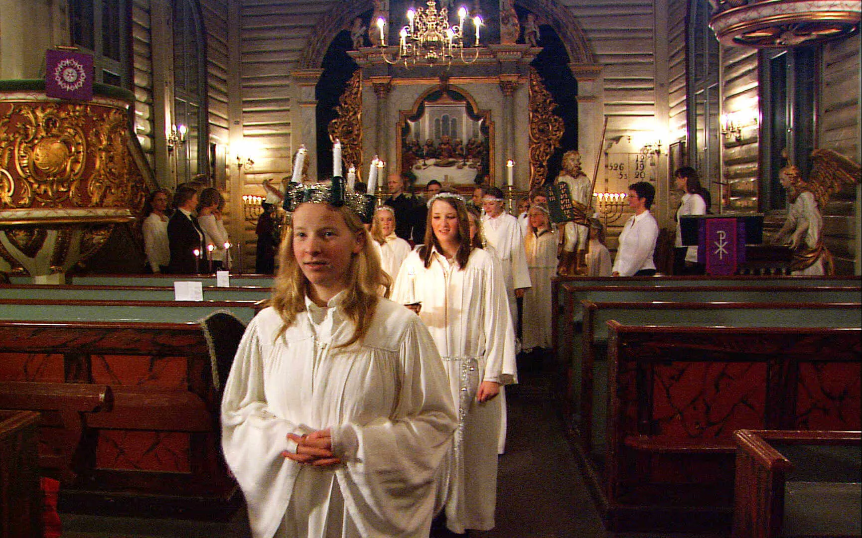 Norwegian girls celebrate the feast of Santa Lucia on December 13 with a candlelight procession