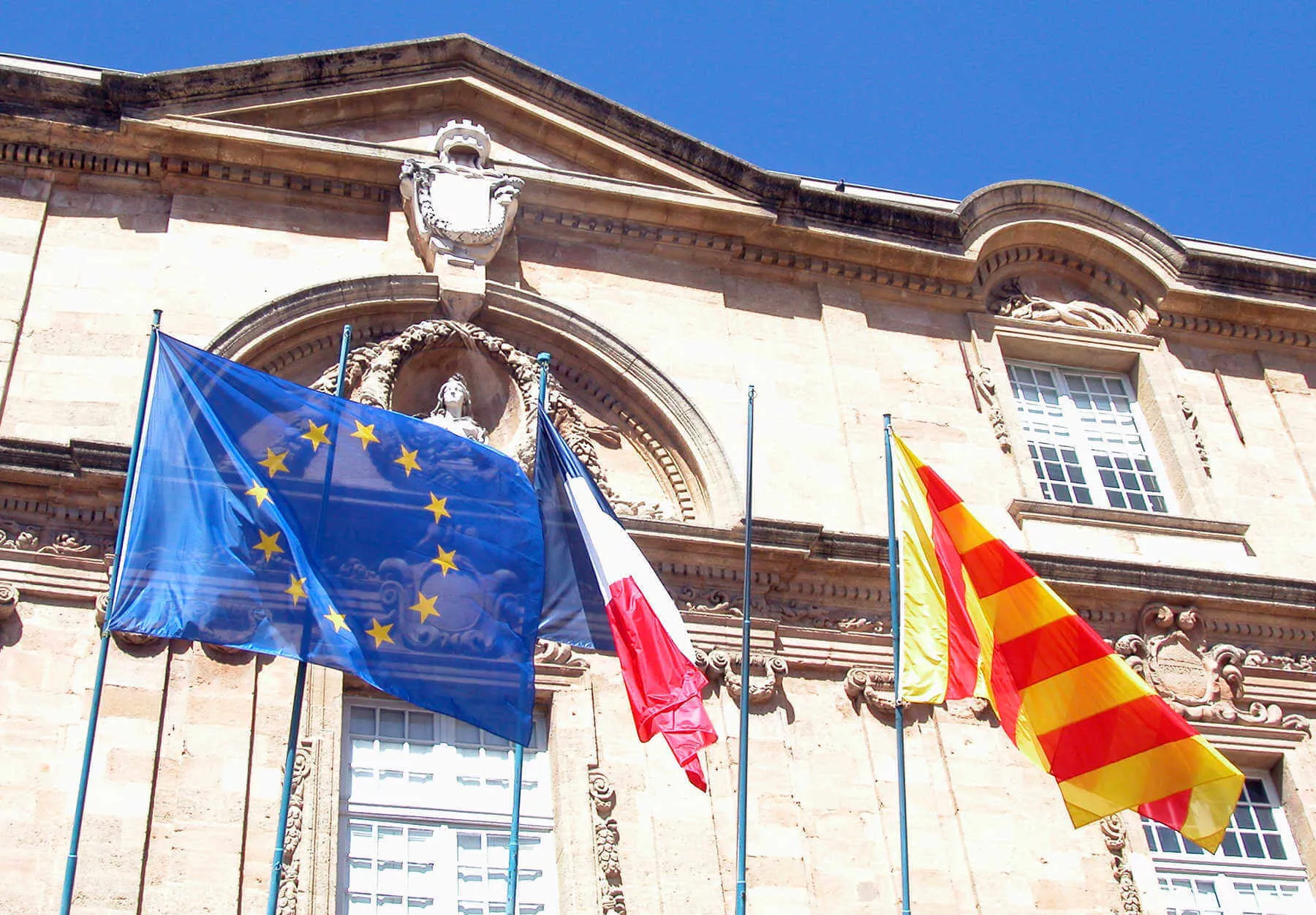 On European town halls, locals often fly three flags. Here in Aix-en-Provence, you’ll see (left to right) the European, national (France), and regional (Provence) flags