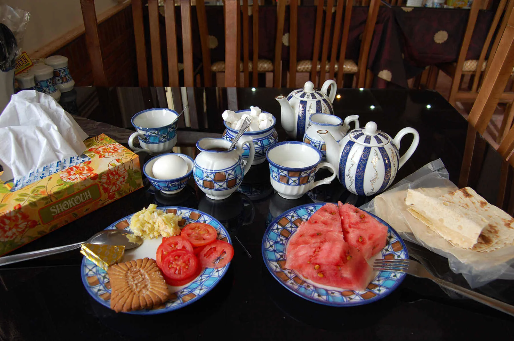 At Iranian restaurants, a box of Kleenex is always on the table, the coffee is instant, the bread is bagged to keep out dust, and juicy watermelon graces every meal
