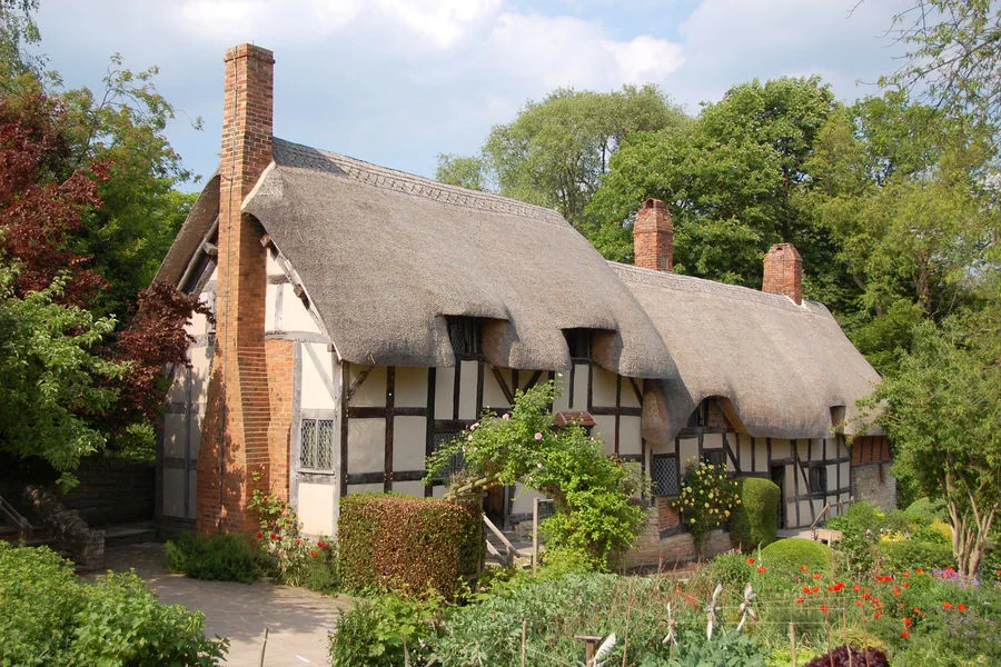 The thatched roof of Anne Hathaway's Cottage, where Shakespeare's wife grew up, seems to drip over the 500-year-old building