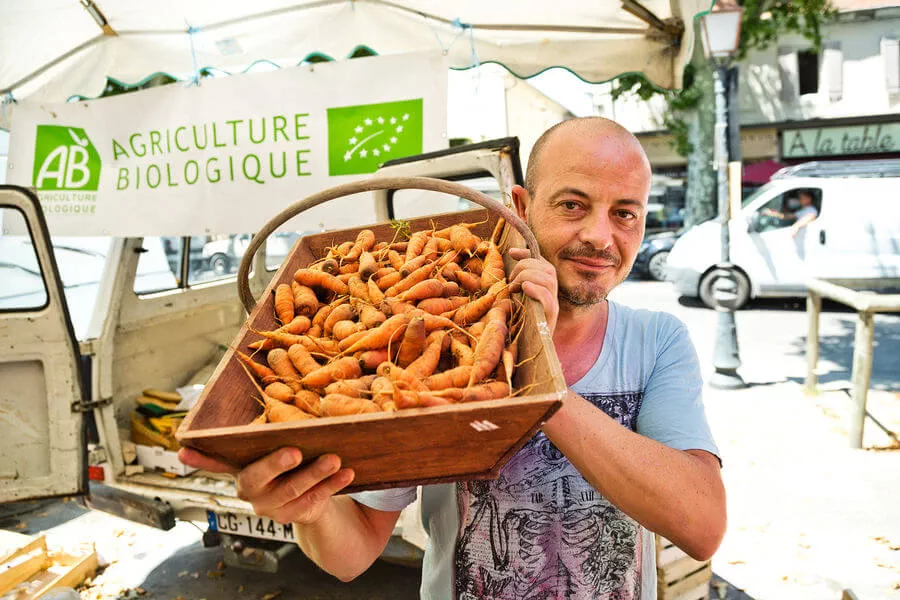 French market vendors take great pride in their produce, such as these organic carrots