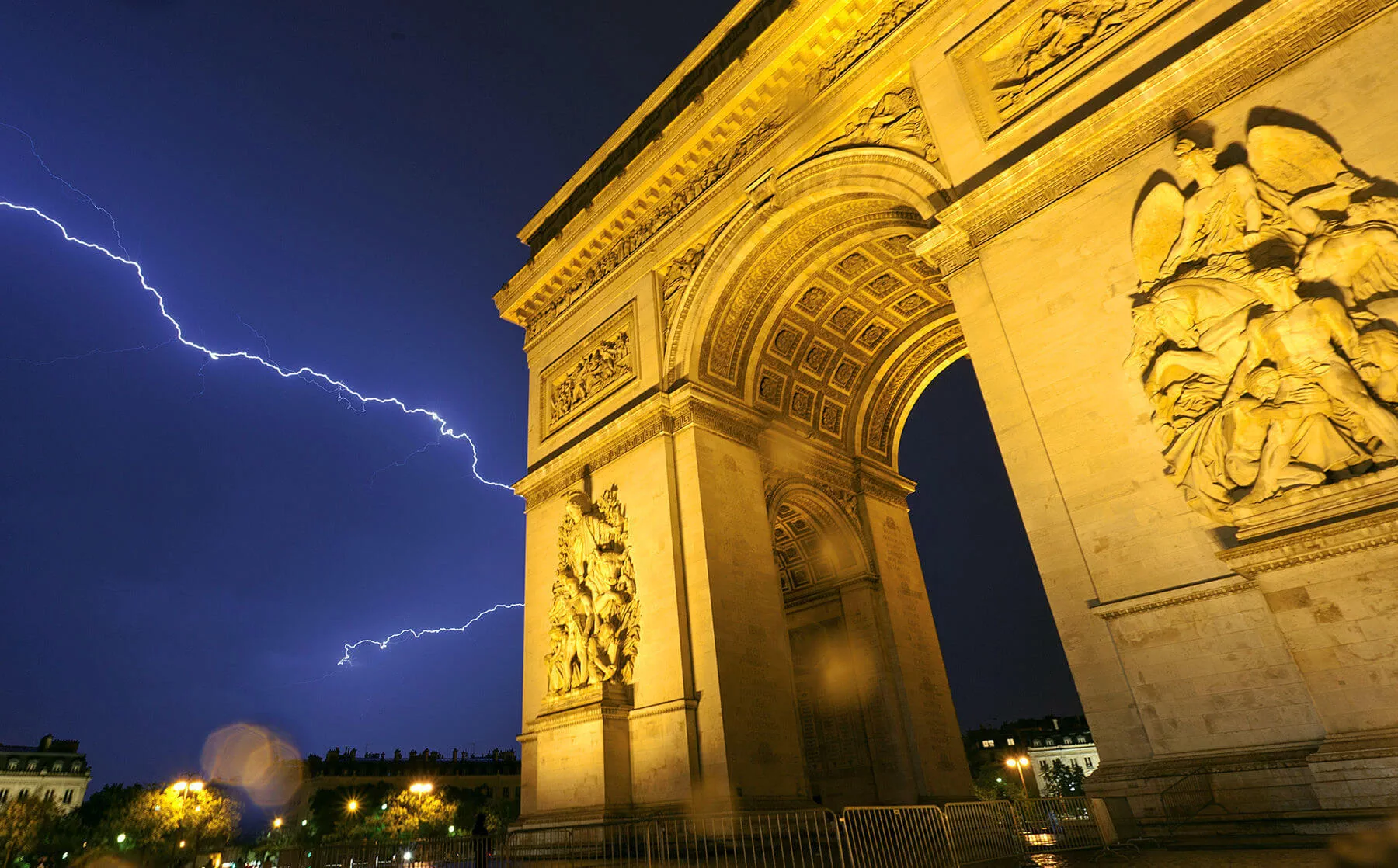 The dramatic Arc de Triomphe, built to honor Napoleon's victories, dominates Paris' skyline day and night
