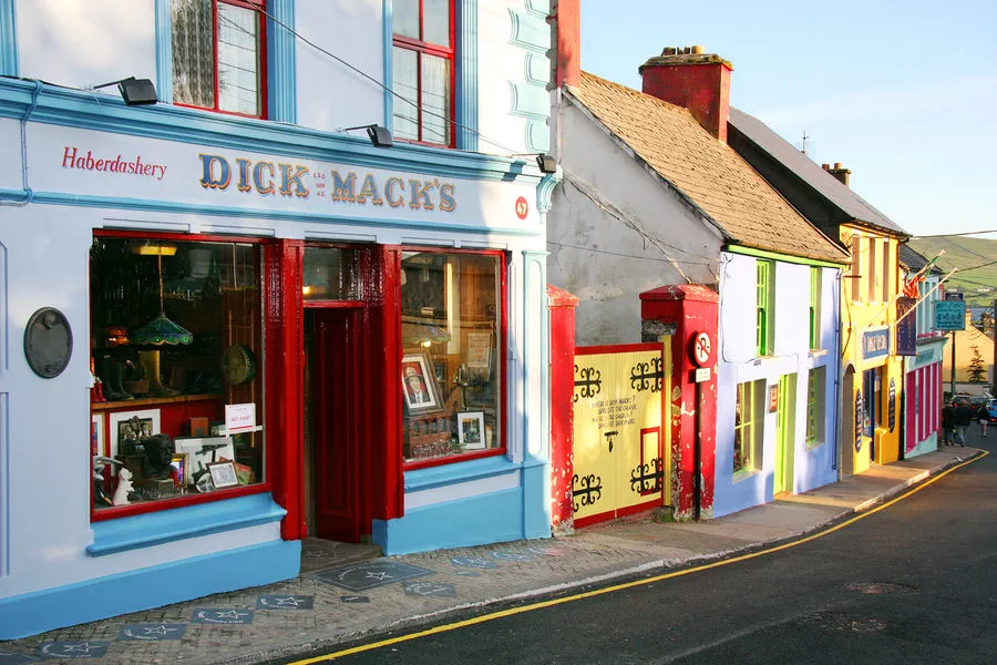 On the colorful streets of Dingle, you'll hear a steady beat of Irish folk music ringing out through vibrant pubs